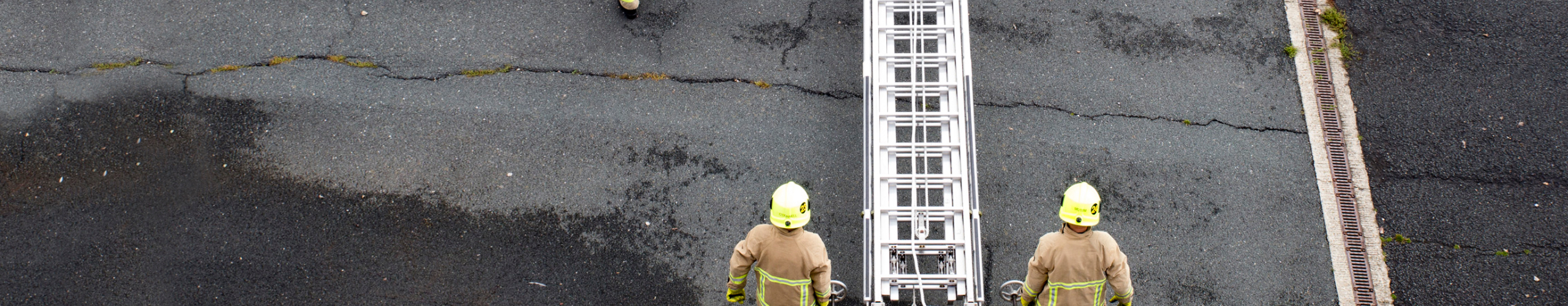 Kent Fire & Rescue firemen carrying ladder