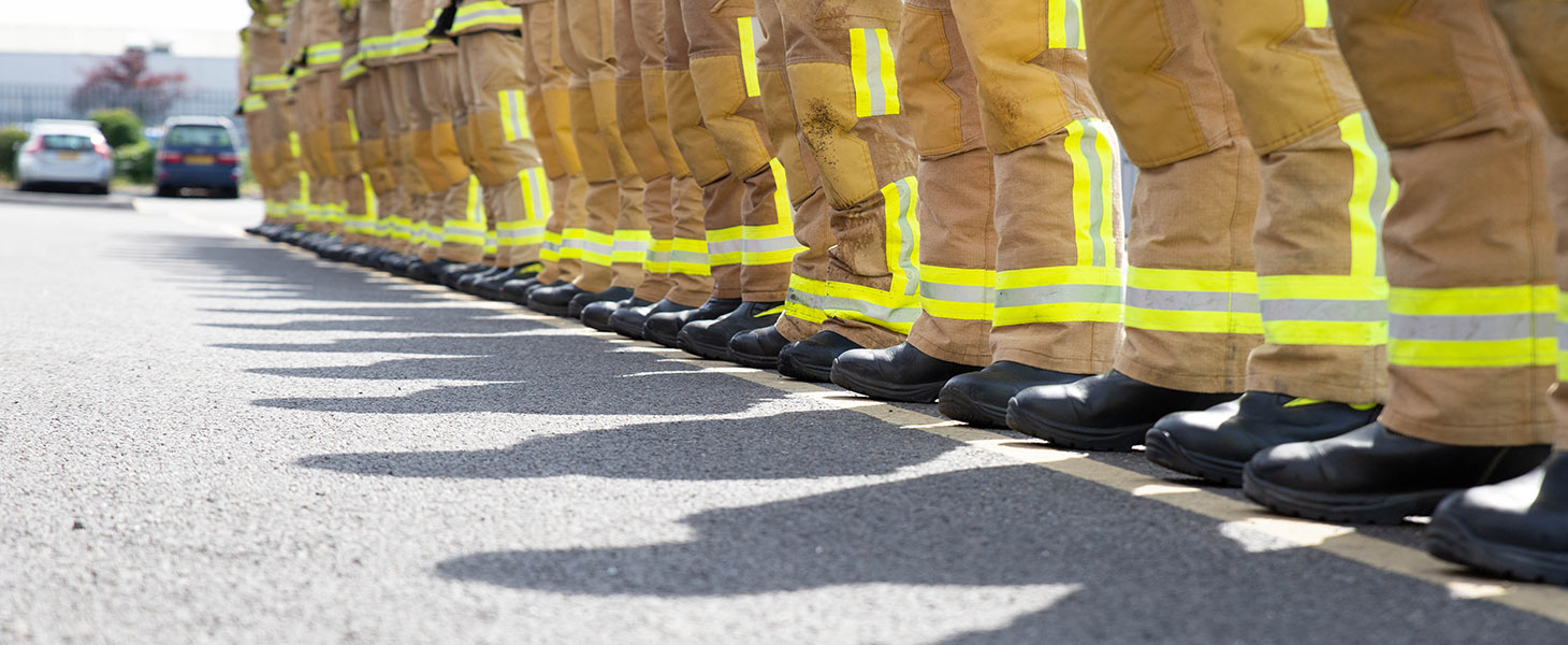 Fire crew line up from low angle of boots