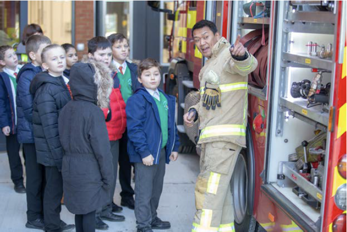 Kent Fire & Rescue fireman teaching children