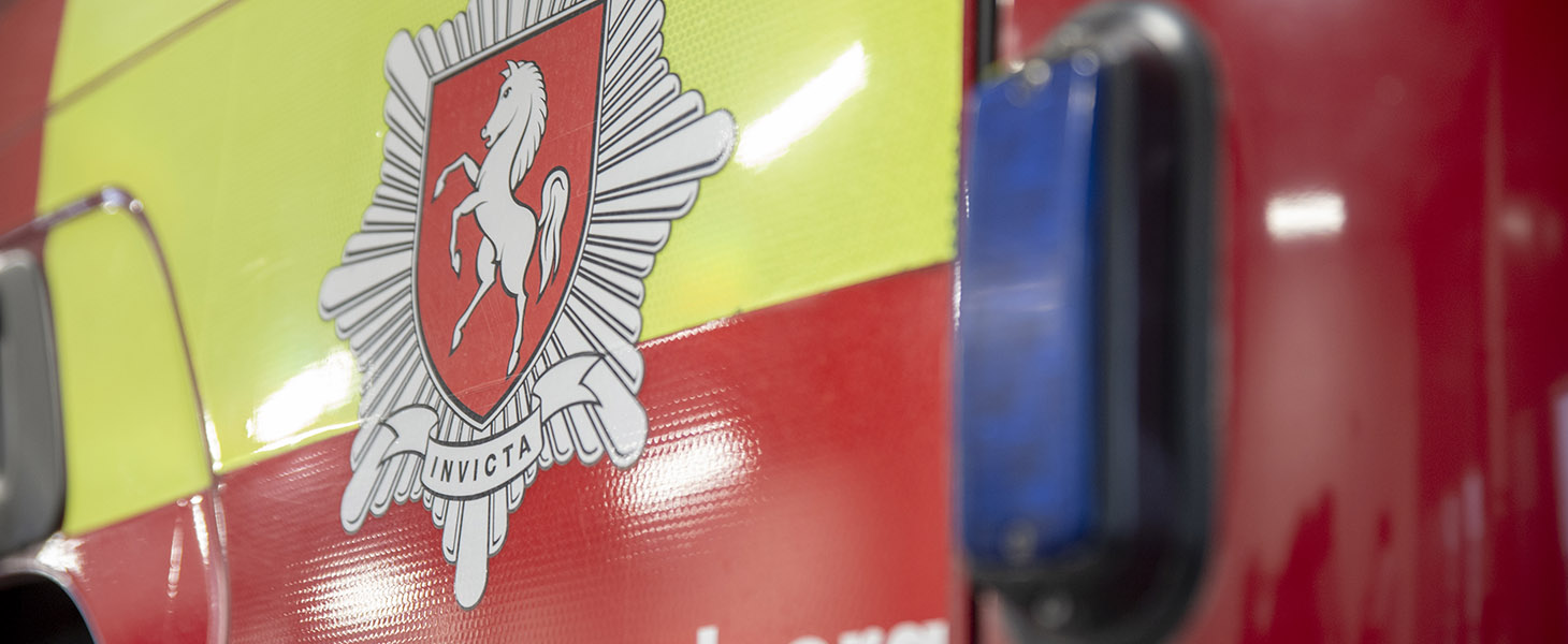 Close up of Kent Fire and Rescue badge on fire engine door